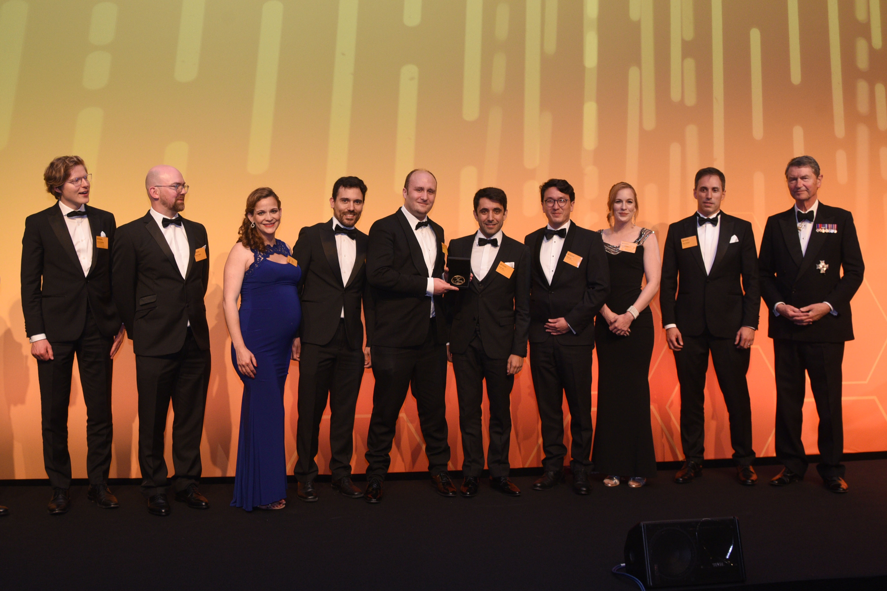 The team from Google DeepMind with Vice Admiral Sir Tim Laurence KCVO CB. Image credit: Rob Lacey