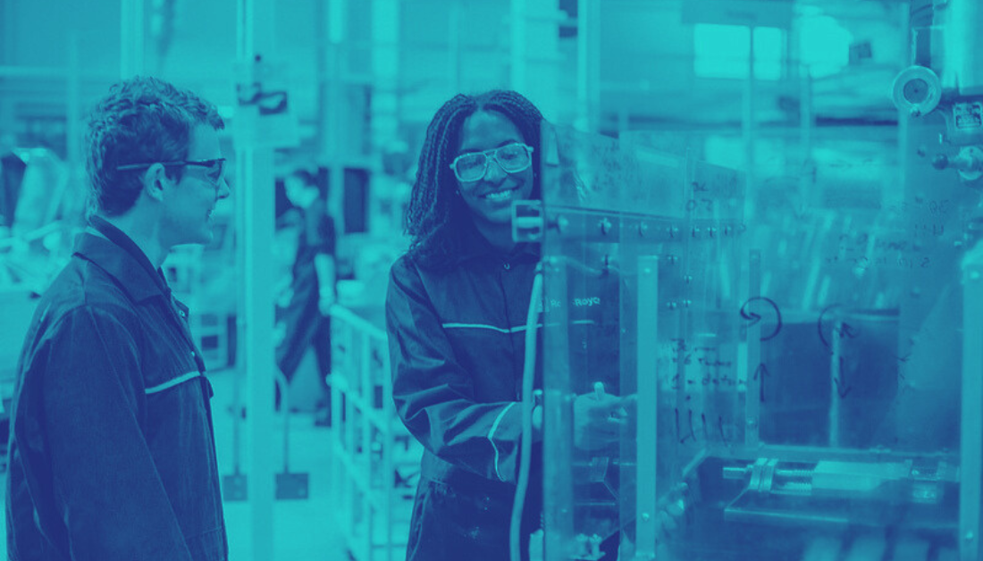 Two engineers by machinery in duotone